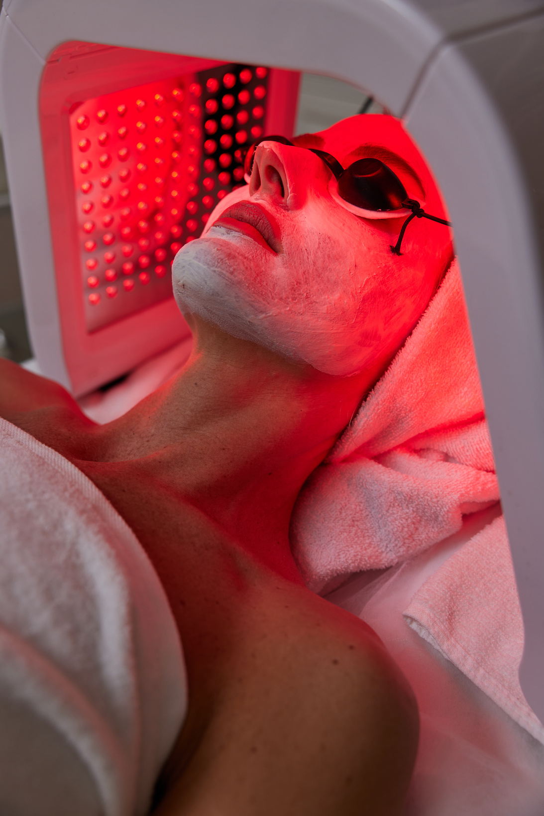 Woman Getting Facial Treatment with Led .